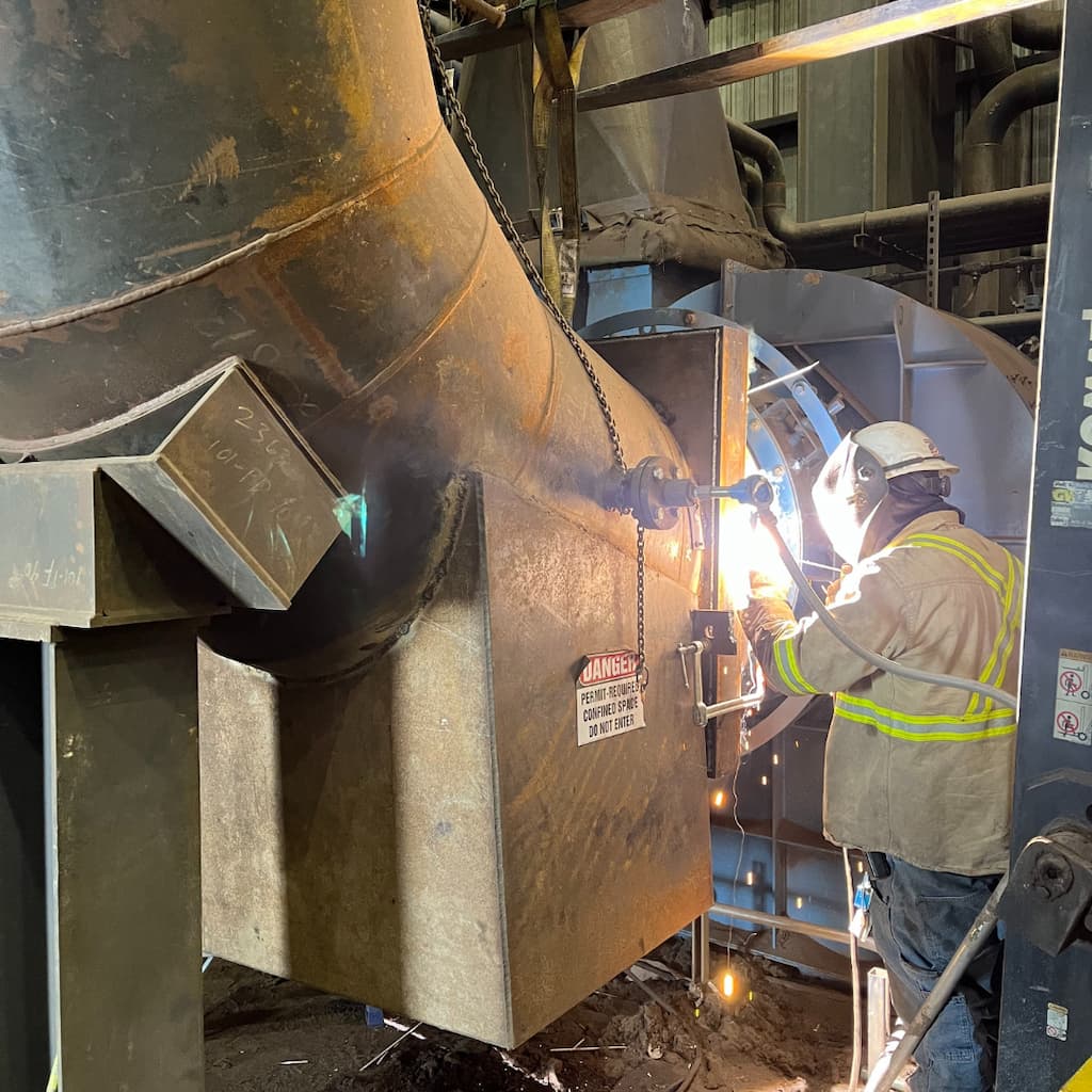 Industrial welding repair performed by a WiseCo Welding & Machine technician in Sedalia, Missouri.